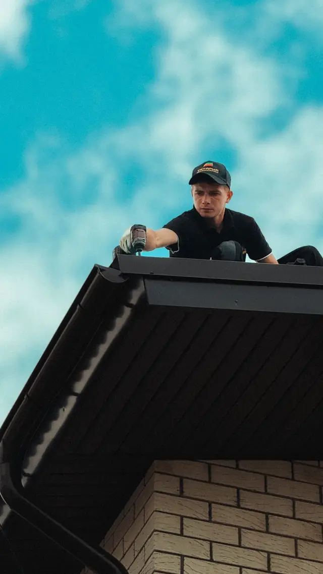 Roofer at the edge of a roof