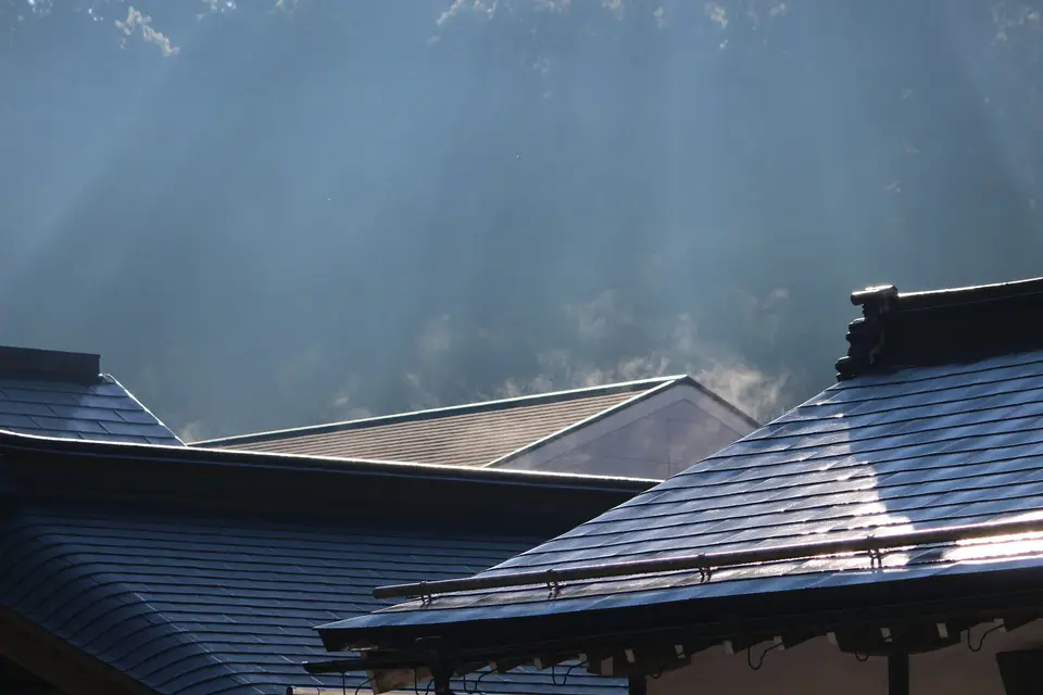 Dark metal roofs catching the sunlight